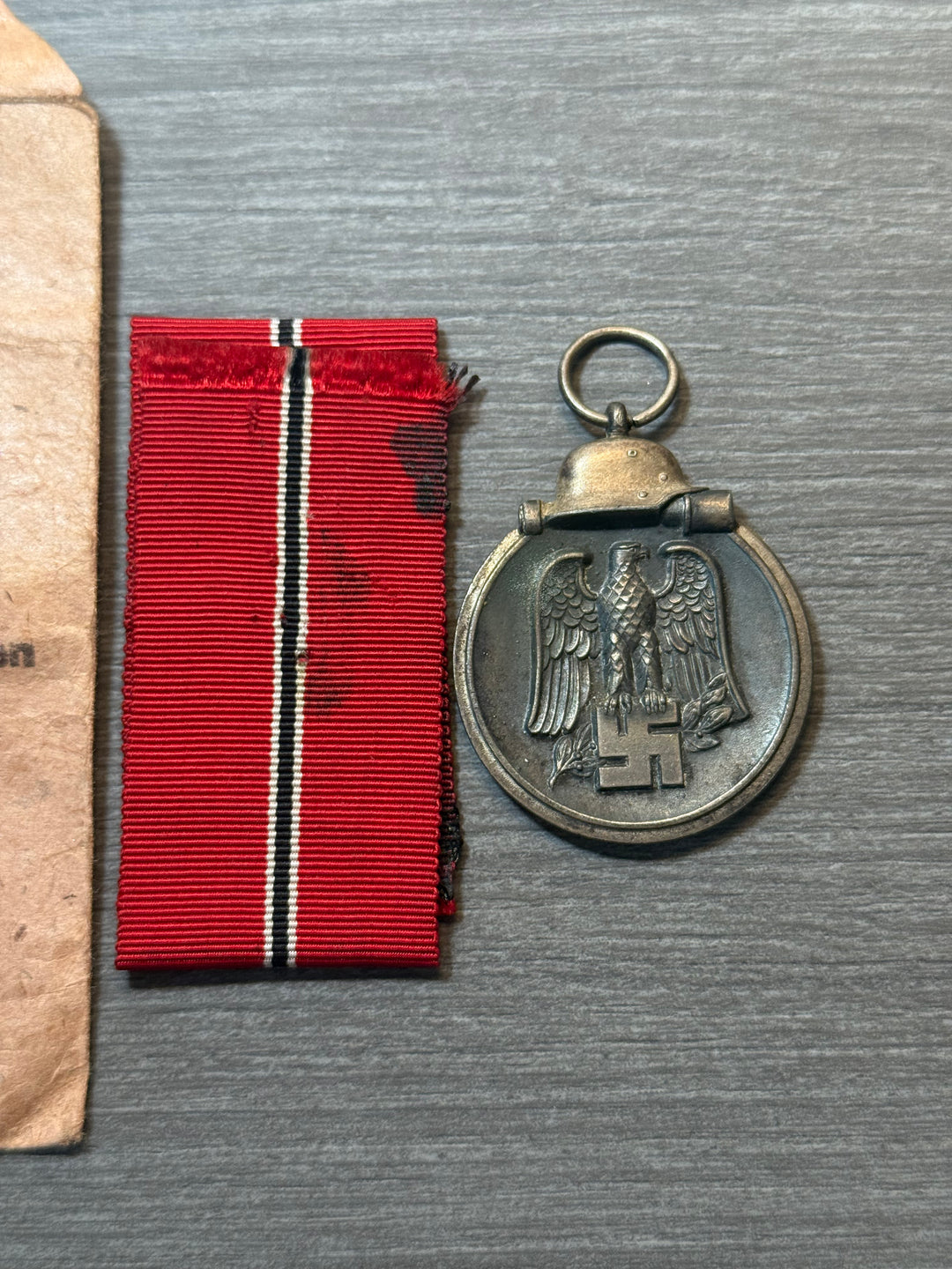 Original WWII German Eastern Front Medal (Ostmedaille) w/ Packet &amp; Ribbon – Maker Marked “77” – Complete Set
