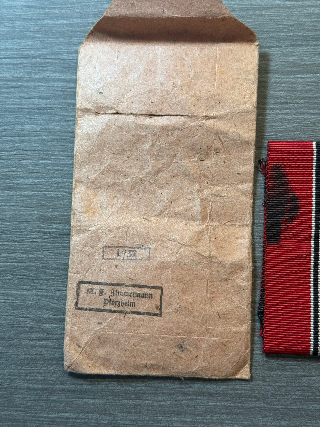 Original WWII German Eastern Front Medal (Ostmedaille) w/ Packet &amp; Ribbon – Maker Marked “77” – Complete Set
