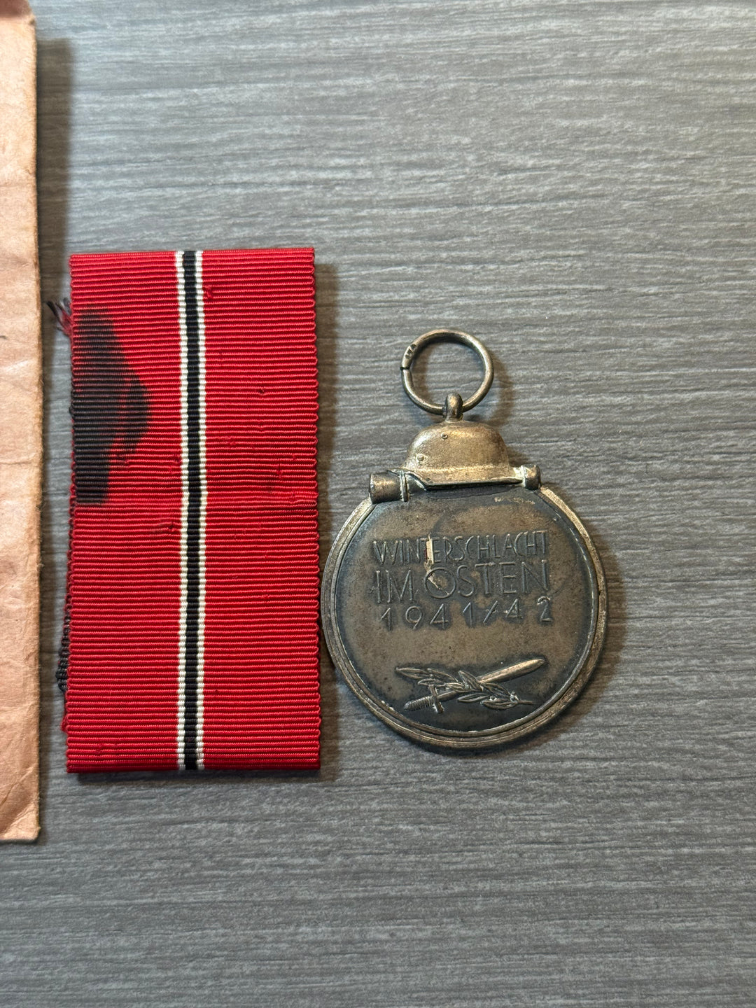 Original WWII German Eastern Front Medal (Ostmedaille) w/ Packet &amp; Ribbon – Maker Marked “77” – Complete Set
